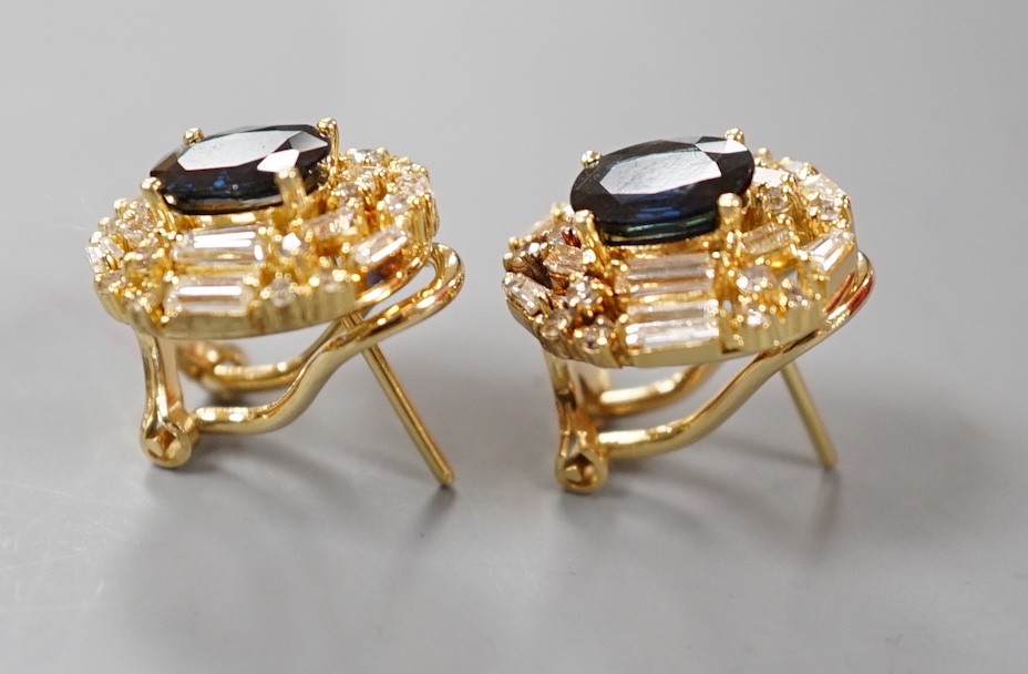 A pair of modern 750 yellow metal, sapphire and diamond set oval cluster earrings, 16mm, gross weight 8.2 grams.